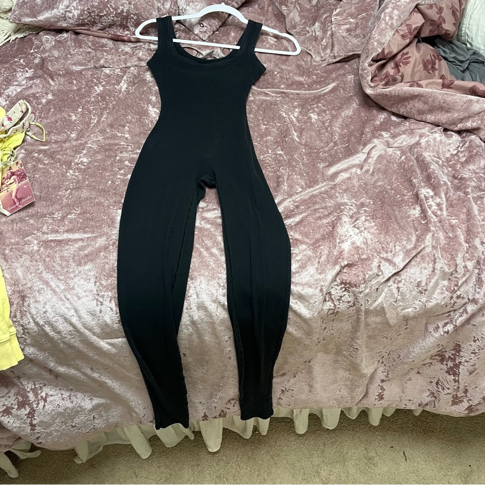 Skims black soft ribbed built-in sports bra jumpsuit